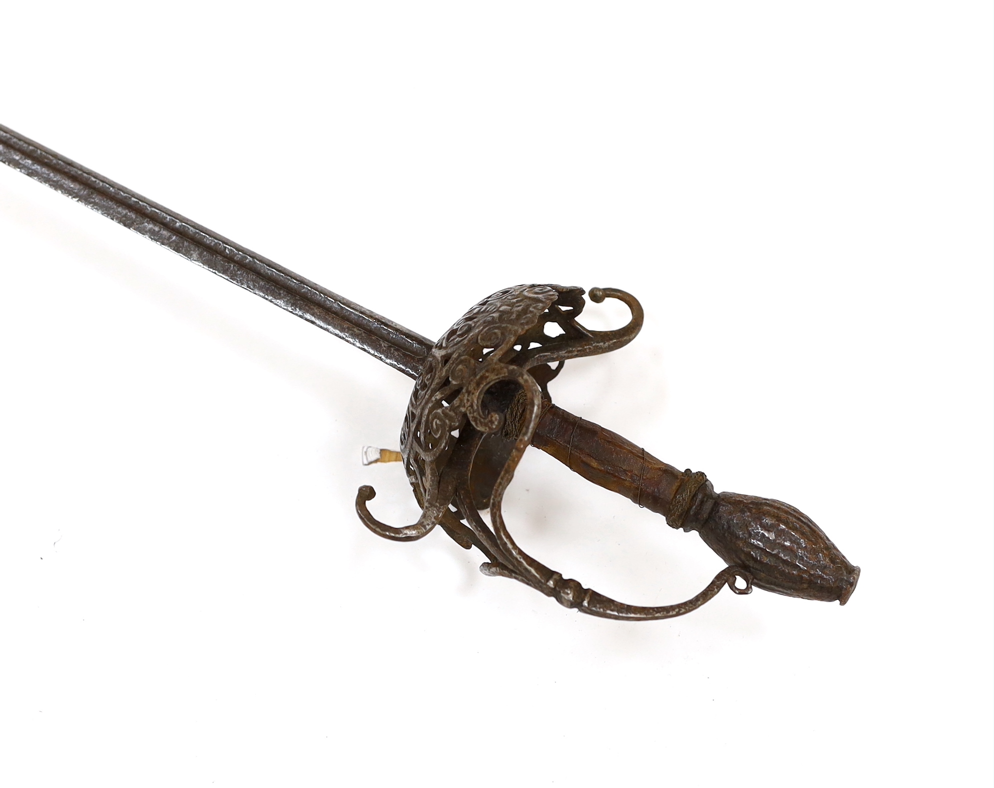 A mid 17th century English rapier, with pierced and chiselled cup guard, steel pommel and leather grip, blade 81cm